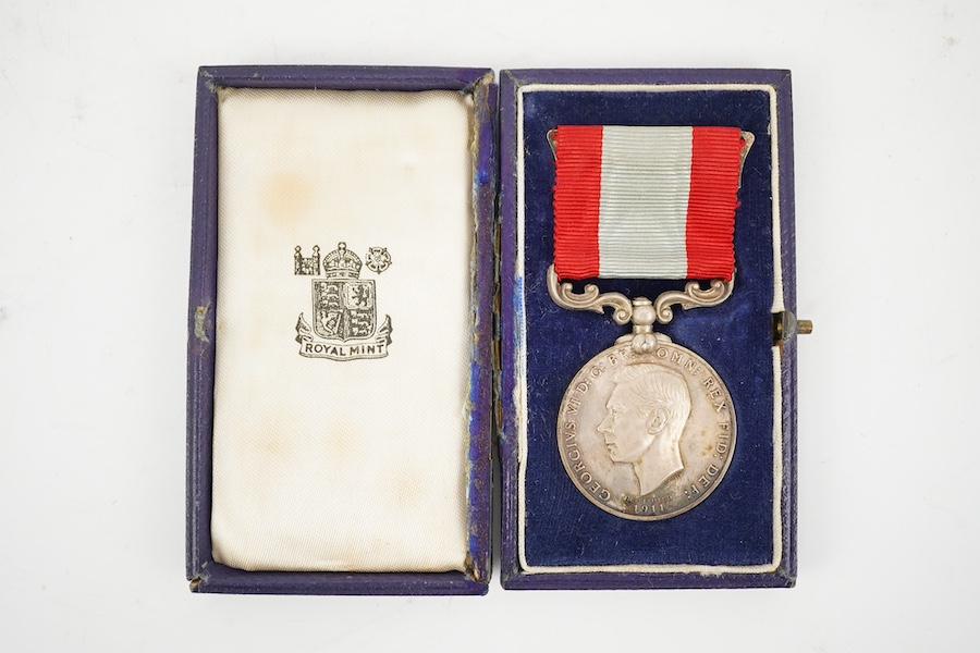 A cased George VI Rocket Apparatus Volunteer Medal Long Service Medal awarded to Harry Charles Palmer. Condition - poor to fair, hinge on the case is broken.